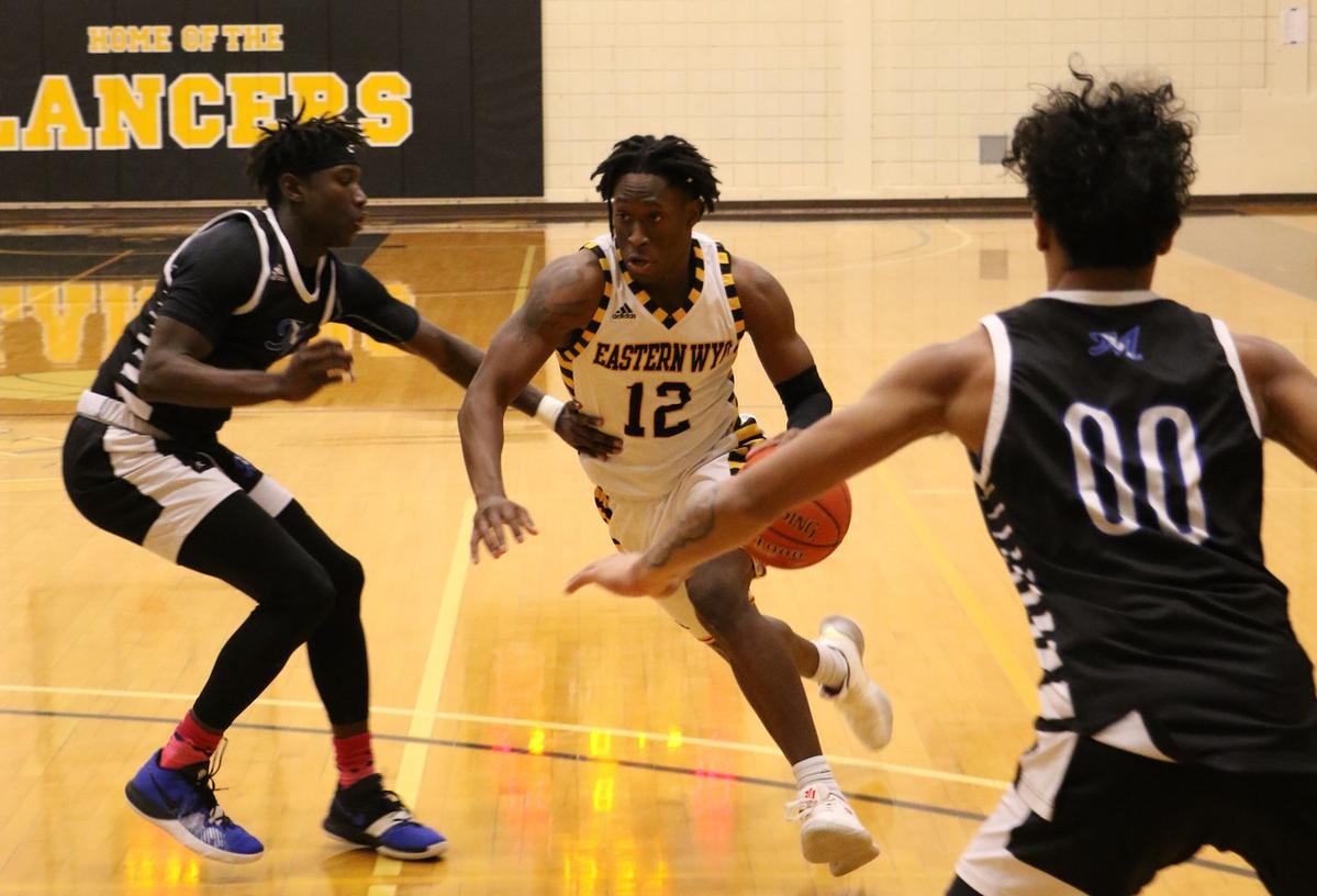 EWC sophomore Earl Baker Jr. drives from the wing during a 76-73 overtime loss against McCook on Saturday. [Photo by Dante Geoffrey]