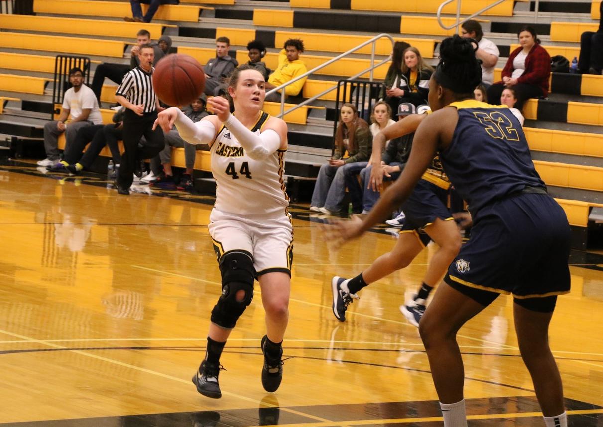 EWC freshman Raleigh Basart gives a no-look pass to a teammate in the corner during the first half of Monday night's game against Western Nebraska.