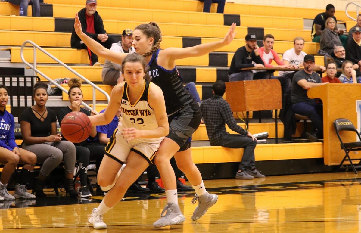 EWC freshman guard Ane Esnal Aguirre drives past a McCook defender during the Lancers' 81-54 win on Saturday afternoon. [Photo by Jay Woldring]